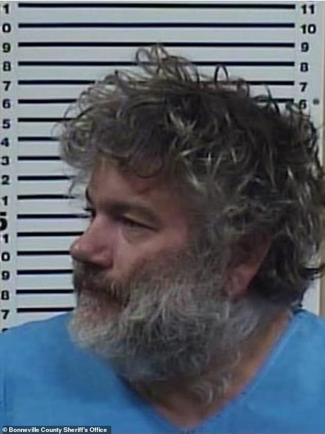 Best, 48, looked dazed and disheveled amid wild hair and a gray beard in the booking photo, taken a day after he was found naked in a forest near the body of his dead 10-month-old son