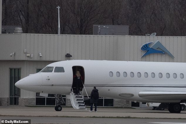 A bodyguard accompanied Mahomes as she left for Wisconsin for Sunday's Chiefs game