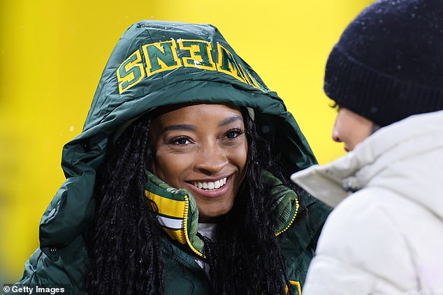 Simone's jacket: The jacket had her husband's number - 34 - in green and gold numbers with his name Owens at the top of the hood