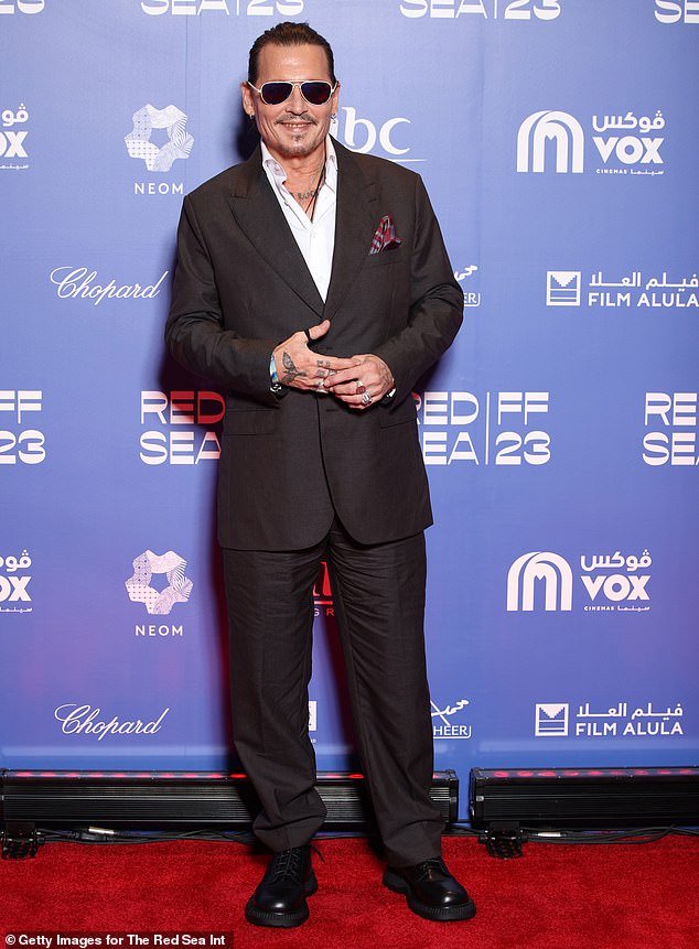 Later on Friday, Johnny was spotted on the red carpet again to attend the screening of his period piece Jeanne du Barry.