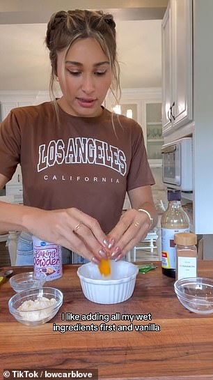 The weight-loss influencer started by mixing melted butter, an egg and vanilla extract in a microwave-safe bowl.  Then she added almond flour, baking powder, cinnamon and stevia