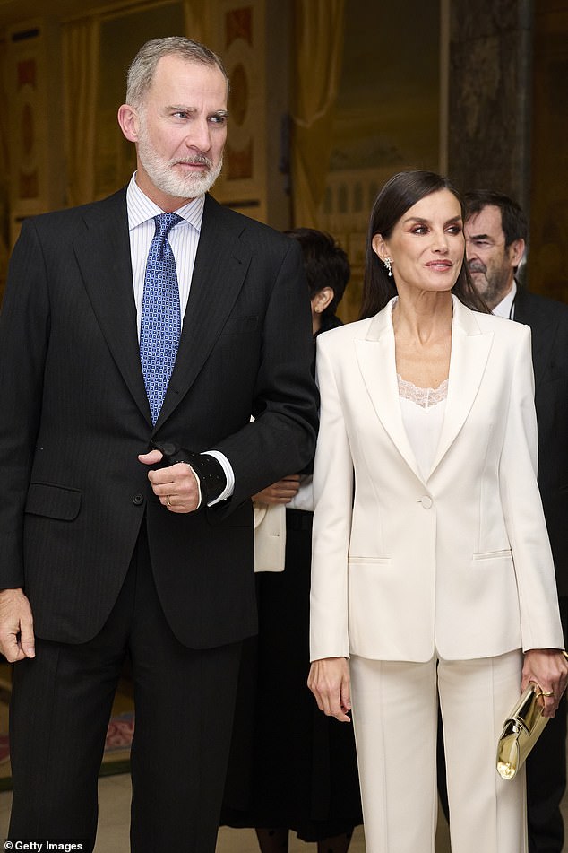 Pictured: King Felipe and Queen Letizia in Madrid last month.  The Queen's ex-brother-in-law claims in new book that the royal family suggested they have a baby together via an American surrogate