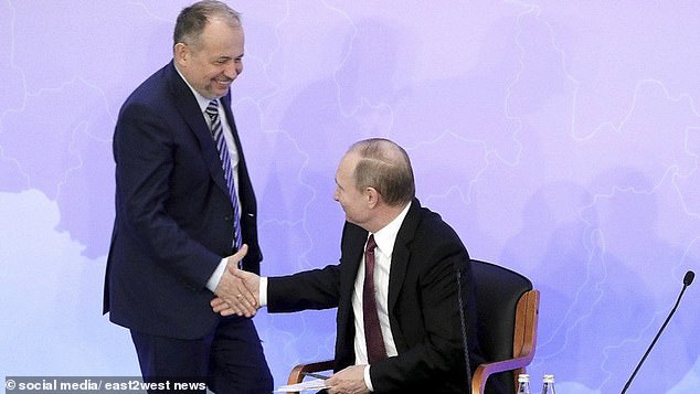 Russian oligarch Vladimir Lisin (L) – 72nd on the Bloomberg Billionaires Index, pictured with Vladimir Putin (R)