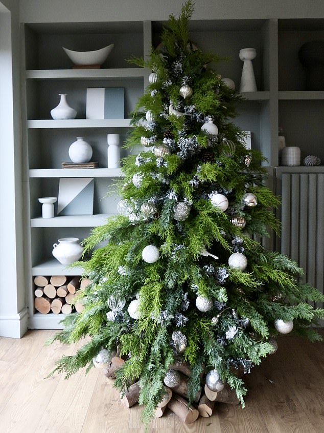 Claire has revamped her old fake Christmas tree by adding bushy branches from her garden