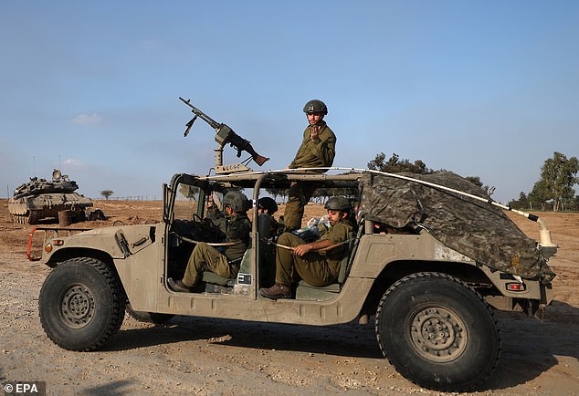 Israeli troops can be seen entering Gaza following a week-long ceasefire with Hamas