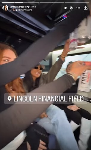 The WAGs were seen making a toast on the way to the match