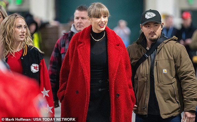 The pop star was spotted arriving at Lambeau Field wearing a red teddy coat with Mahomes