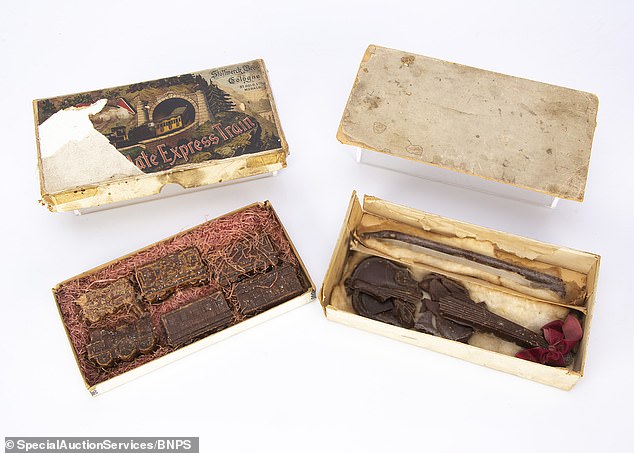 The auction includes these rare novelty chocolates from Stollwerck Bros from the early 20th century, with a train carriage and a violin and bow