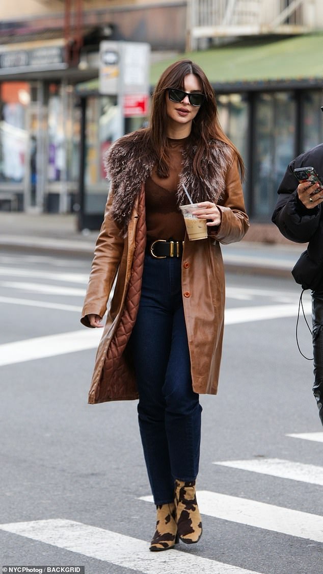 The mother-of-one showed off her slim body in the completely sheer top as she enjoyed an iced coffee with friends