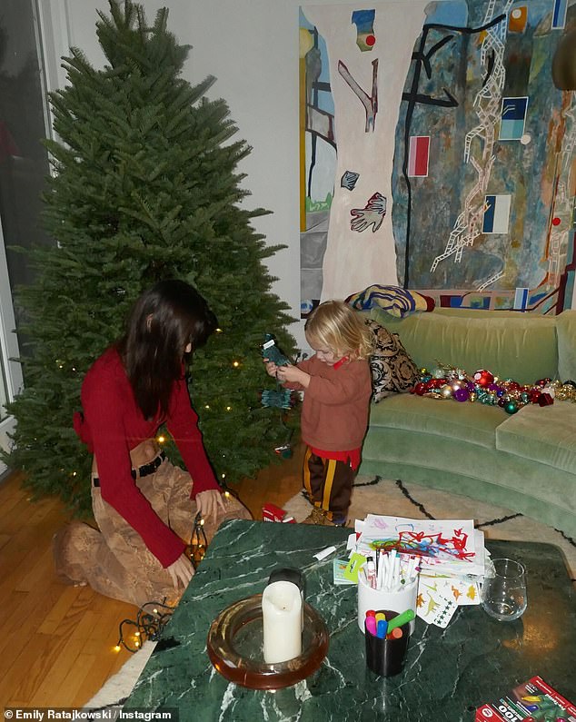 Emily's outing comes hours after she shared adorable photos of her and her son Sylvester, two, decorating their Christmas tree