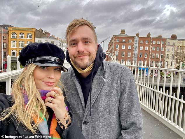 Laura is married to presenter and comedian Iain Stirling and the couple share a daughter who they welcomed in March 2021 (pictured with Iain in 2020)