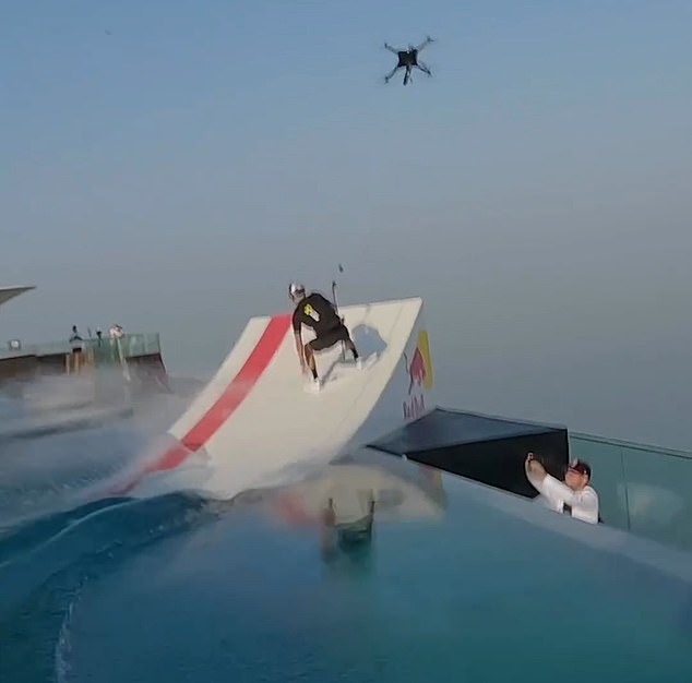 The heart-wrenching footage showed the daredevil speeding past the 100-metre-long rooftop pool before climbing up a ramp at the end