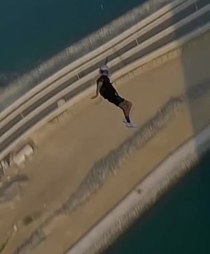 Brian charges to the ground after launching himself from the top of the Address Beach Resort building