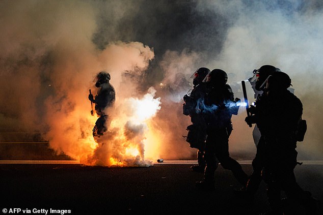 Many doomsday preppers said they are taking precautions ahead of the 2024 election because they fear it will lead to civil unrest.  Police are seen during a Black Lives Matter riot in Portland, Oregon, in September 2020