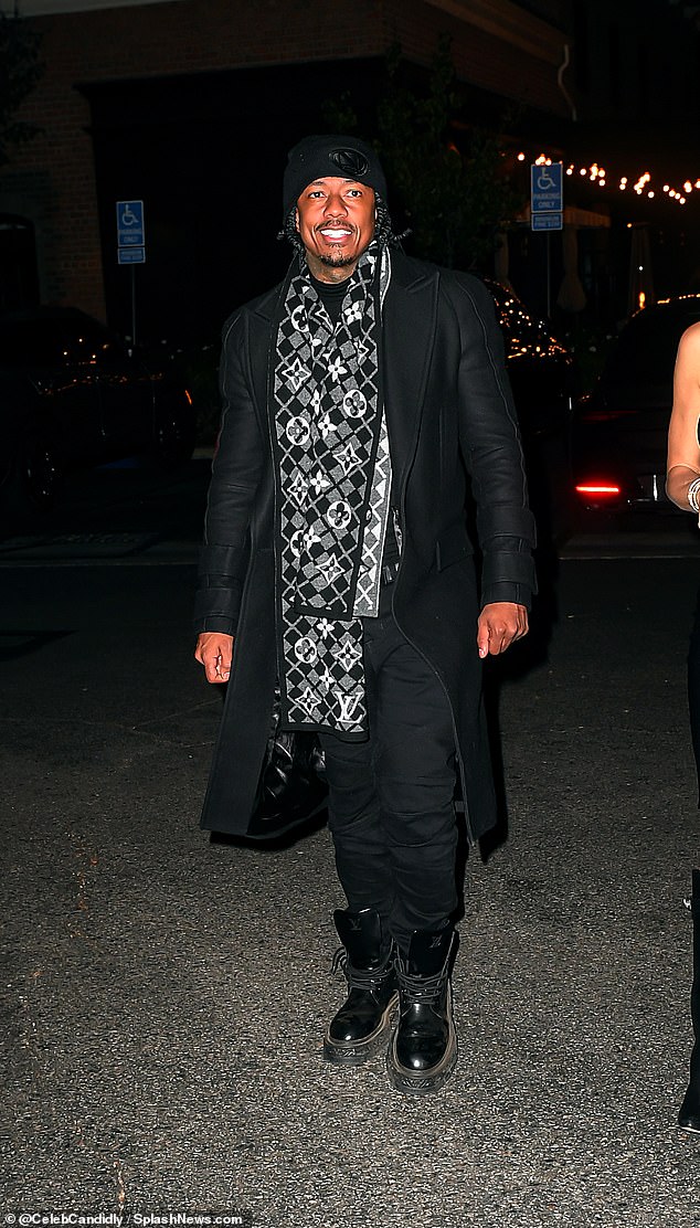 Cannon was pictured donning a long black peacoat over a black shirt with black jeans and black boots