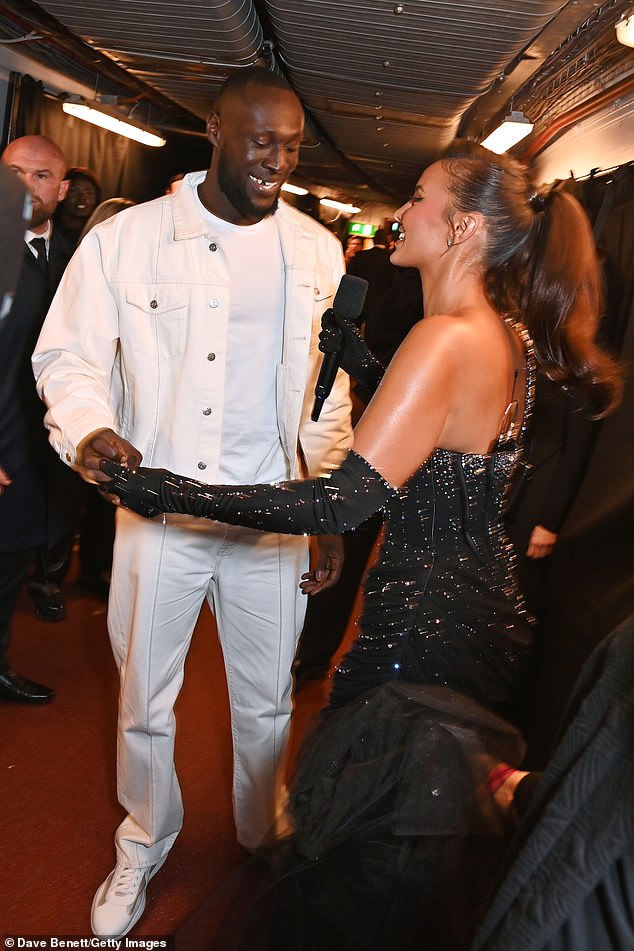 Stormzy, meanwhile, looked dapper in an all-white outfit as he and Maya chatted and looked cozy backstage