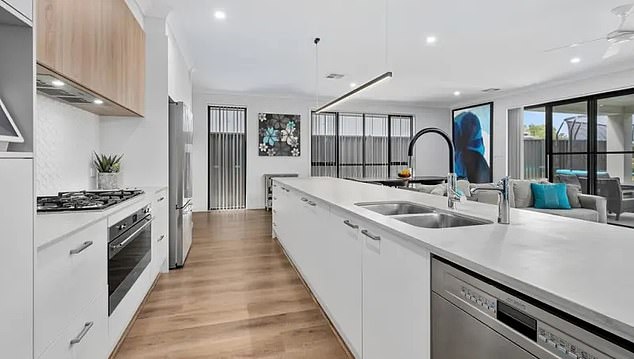 Pictured: The lavish kitchen in Erin Phillips' West Lakes home