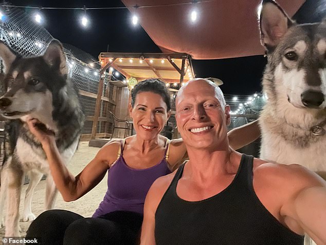 The couple is pictured with two huskies.  Gatt has a condition called alopecia universalis, which caused him to lose all his hair at the age of 14