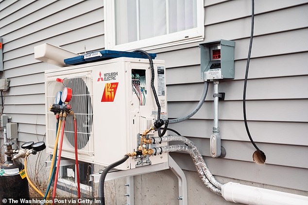 Heat pumps do not generate heat, but redistribute it around a house.  Pictured is a newly installed heat pump mounted on the side of a house in Windham, Maine