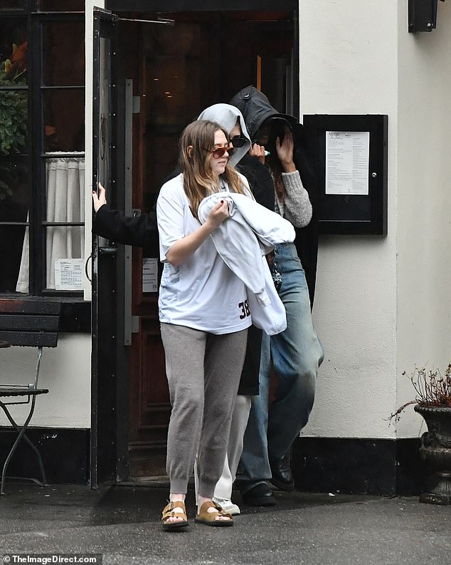 The former First Daughters and their friends were woefully unprepared for the rain