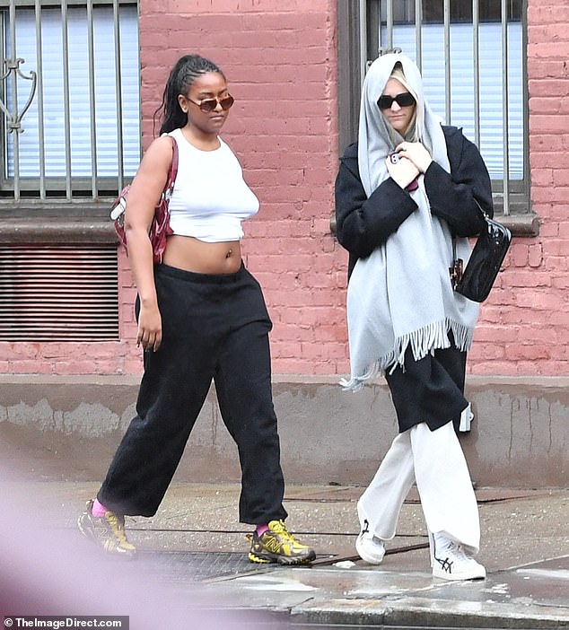 Obama's youngest sister had her long braids pulled up into a ponytail for the outing