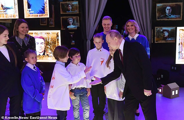 Putin was seen in a recent photo greeting children with no apparent sanitary problems