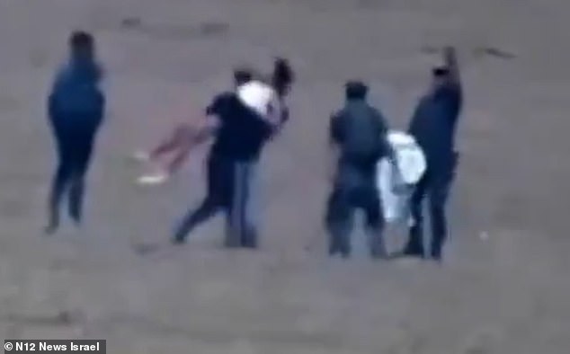 One terrorist lifted the Israeli lawyer onto his back, but fell to the ground as she kicked and writhed against him