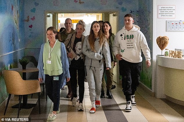 Mia is seen with family members at the Sheba Medical Center in Ramat Gan, Israel after her release