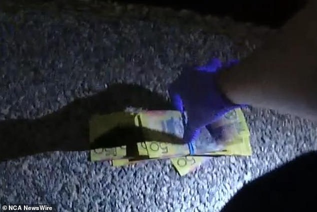 The stash of cash is believed to have been part of a drug deal gone wrong that saw police arrest a man who was reportedly sitting in a parked car when officers found the cash nearby.