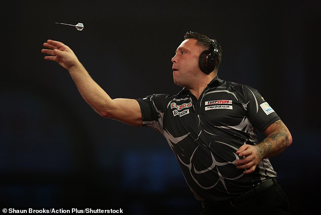 The world number 1 wore the headgear during the quarter-final of the PDC World Championships