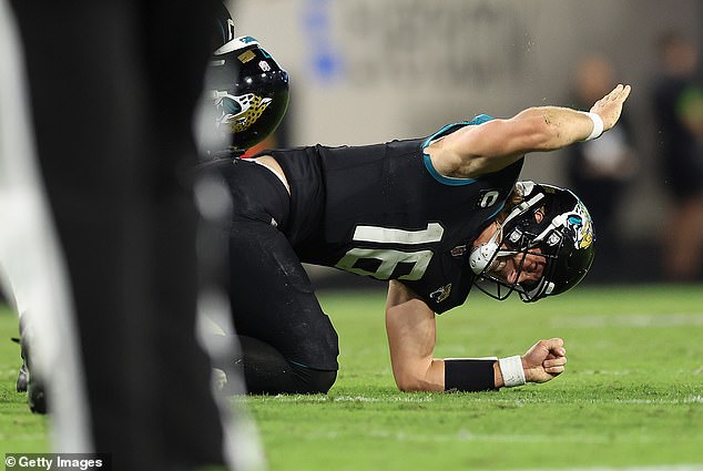 Lawrence hit the turf in dismay after trying and failing to walk on his injured ankle