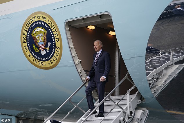 President Joe Biden is photographed arriving in Boston on Tuesday.  The president has promoted an electric vehicle agenda since taking office, and the lack of built-in charging stations could hurt that message during his 2024 re-election bid.