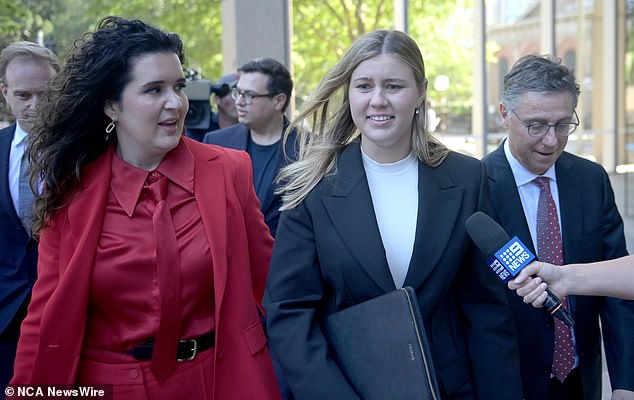 Ms Higgins (centre) announced on Tuesday that she had received $1.9 million in damages