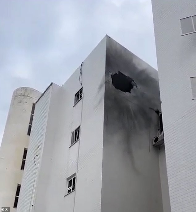 A school in Tel Aviv was damaged by shrapnel from the same explosion, leaving a hole visible in the building