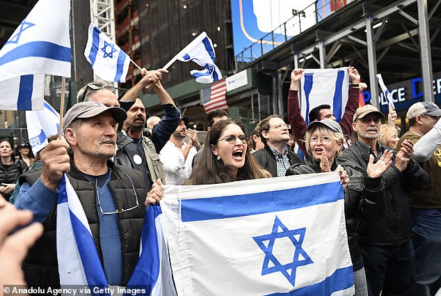 A day after the barbaric Hamas attack on Israel, pro-Israel supporters gathered in Times Square, waving and holding up the Israeli flag