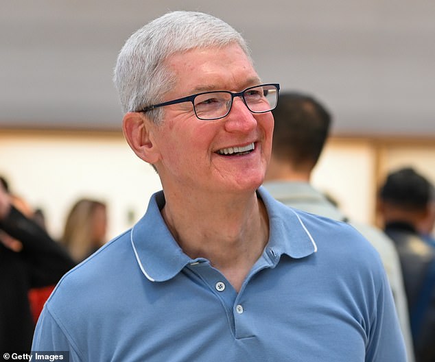 Apple CEO Tim Cook at an iPhone 15 launch event.  The company predicts that sales for the Christmas quarter will be roughly in line with last year