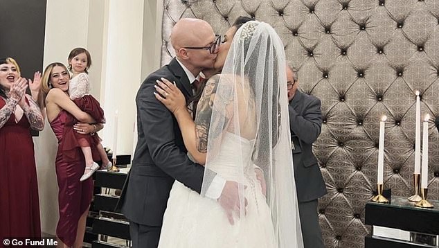 Brewer with her husband Scotty on their wedding day