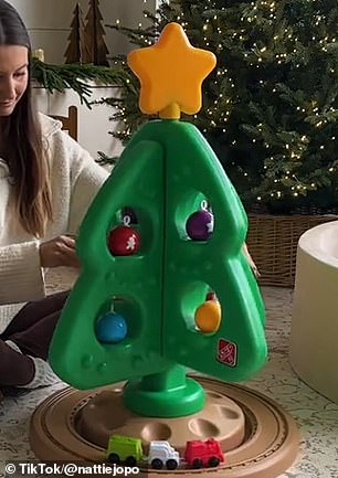 Nattie showed off what the muted tree looked like in the family home before concluding: 'I absolutely love it.'  In the photo: in the past