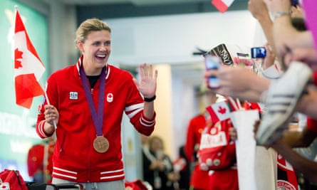 Christine Sinclair waves to fans after returning to Vancouver with a bronze medal after the 2012 London Olympics