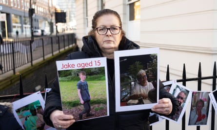 Kathryn Butcher with a photo of Jake Corser, 15, and Myrna Saunders, 56,