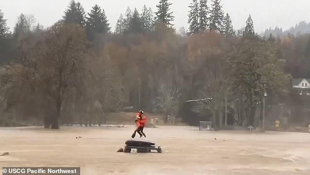 The Washington State Coast Guard has shared footage of the incredible moment when crews used an MH-60 Jayhawk to carry a man to safety in the coastal city of Astoria, just across the southern border in Oregon.