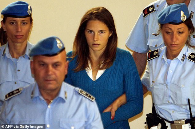 Knox is escorted to court on September 26, 2008