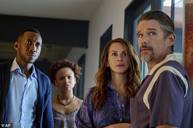 Mahershela Ali from left, Myha'la Herrol, Roberts and Ethan Hawke in a scene from Leave the World Behind