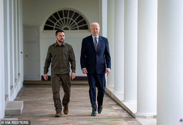 Ukrainian President Volodymyr Zelensky walks with Biden through the White House colonnade to the Oval Office in September