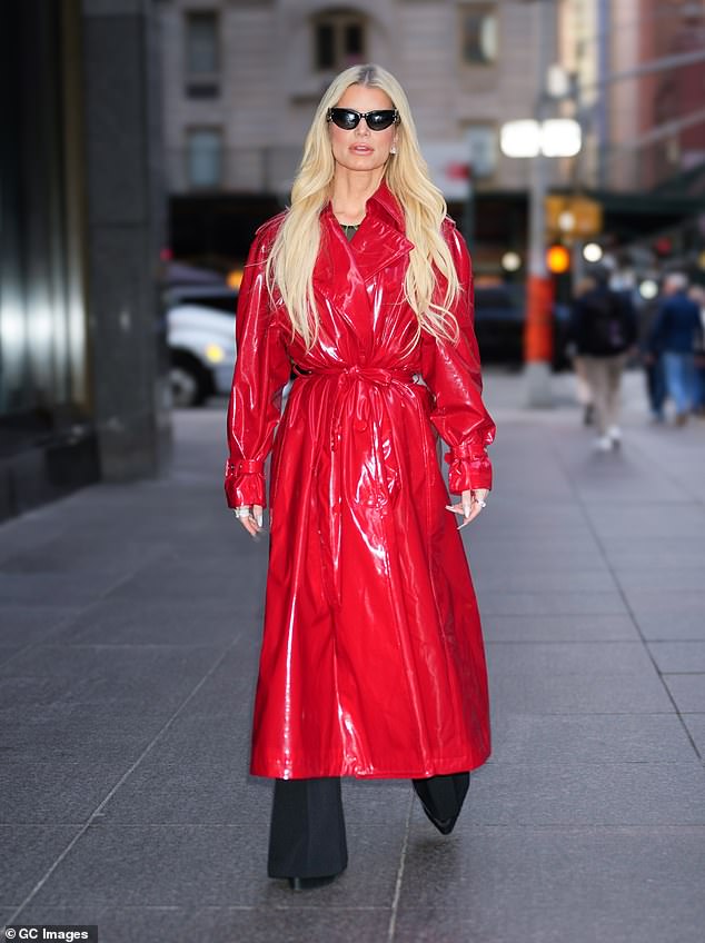 Last week, Jessica turned heads in a bright red duster coat, with black pointed boots and matching pants