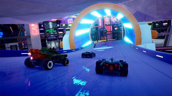 Cars race down a shiny blue track into a tunnel in a screenshot from Hot Wheels Unleashed 2