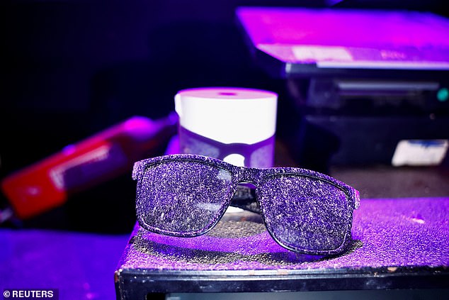 Sunglasses speckled with paint.  During the nighttime festival, approximately 364 people were shot, clubbed or burned to death