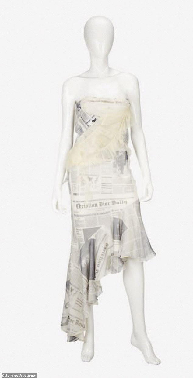 Newsprint: John Galliano for Christian Dior's strapless silk chiffon dress with an asymmetrical frilled hem expected to sell between $8,000 and $12,000