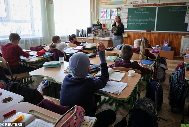 Returning to school, Roman can be seen actively participating in class