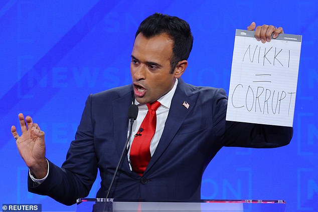 Vivek Ramaswamy held up his notepad with the message 'Nikki = Corrupt' after criticizing Nikki Haley for embracing the left's 'identity politics' because she brought up the fact that she was a woman